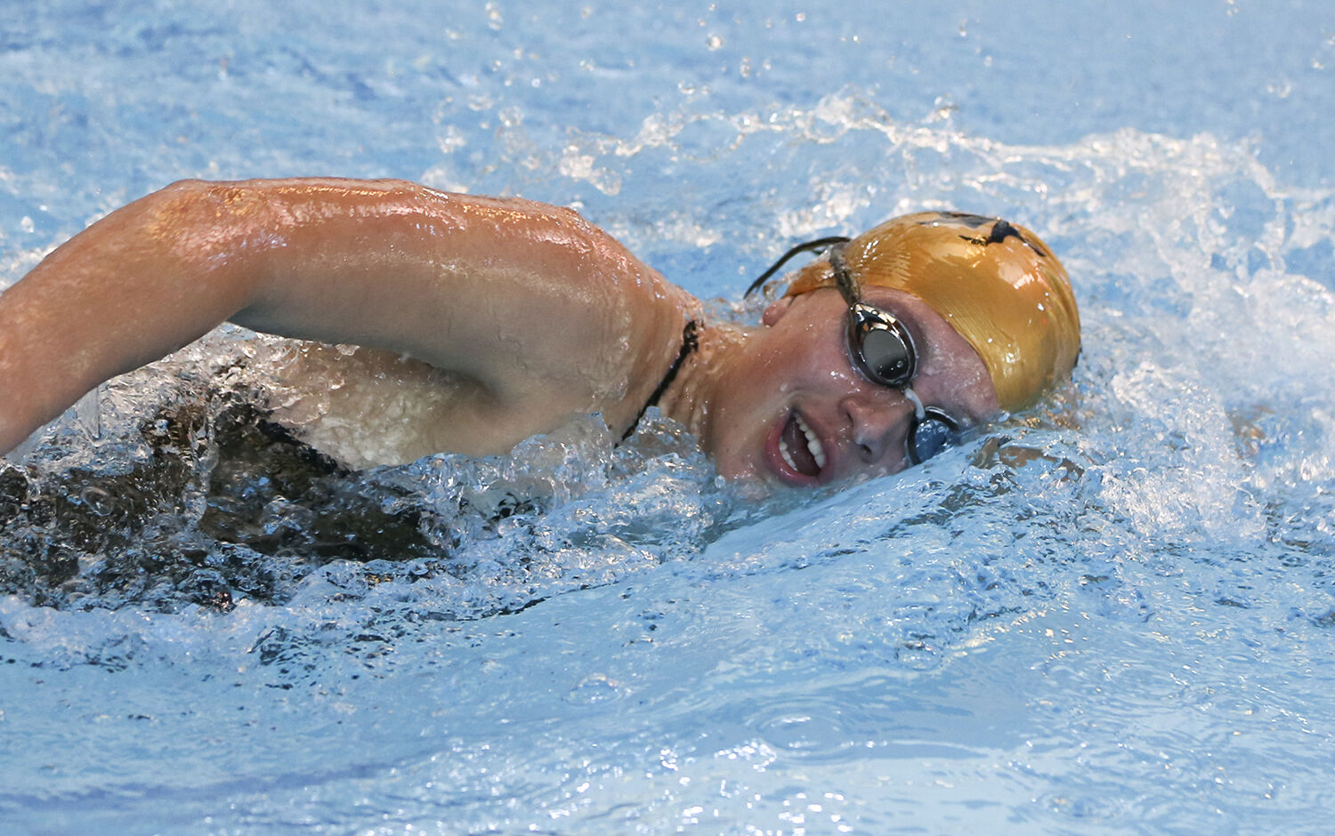 Grace Wagner takes a breath during her 200 yard freestyle race